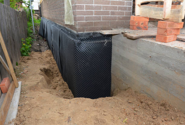 Happy homeowners after waterproofing job in Milton